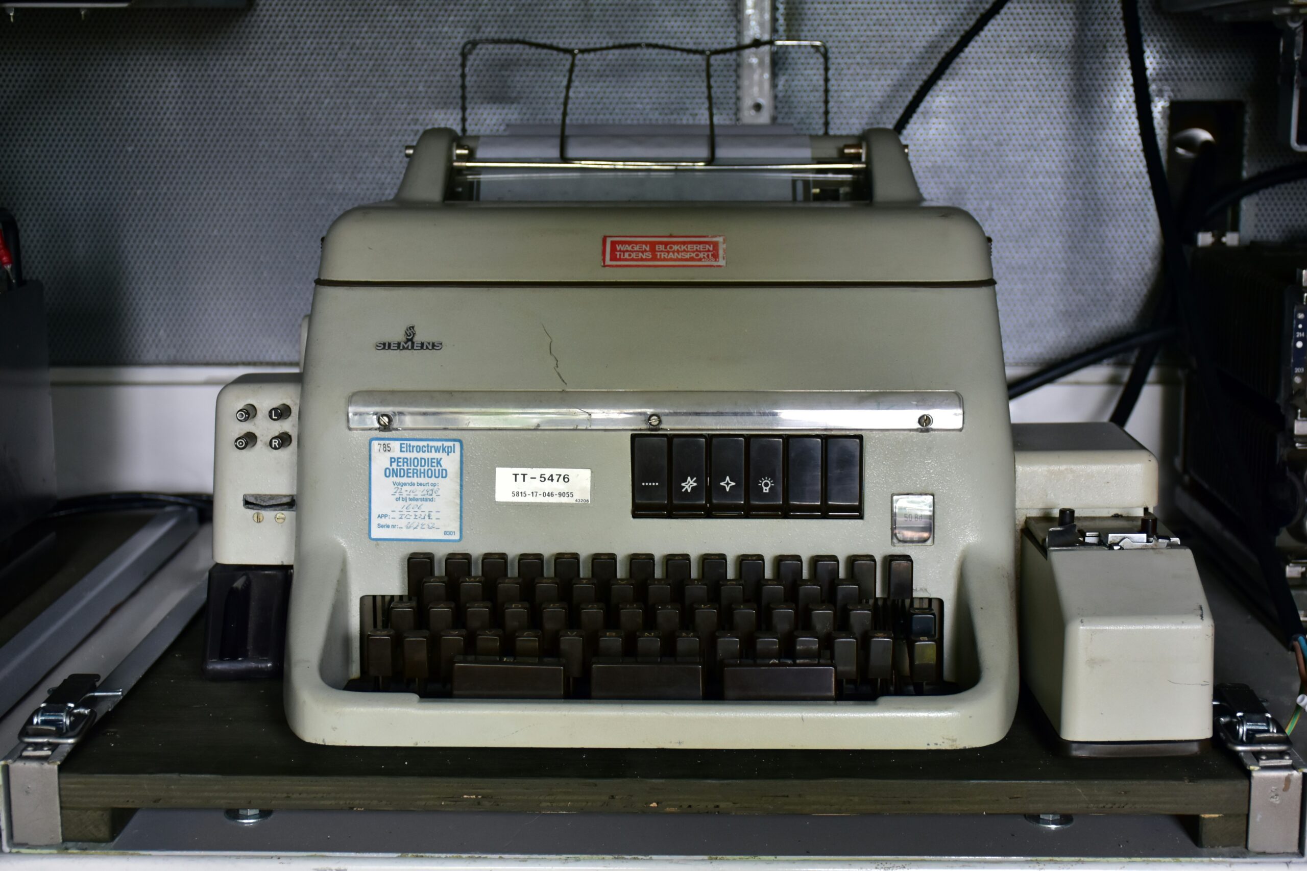 an old typewriter sitting on top of a table